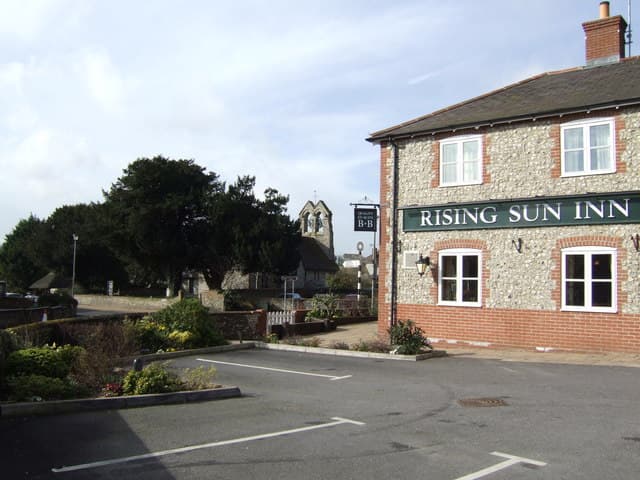 St James's Church and The Rising Sun pub in the old village of Clanfield
